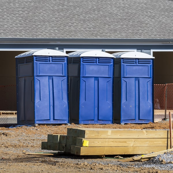 what is the cost difference between standard and deluxe portable restroom rentals in Greenfields